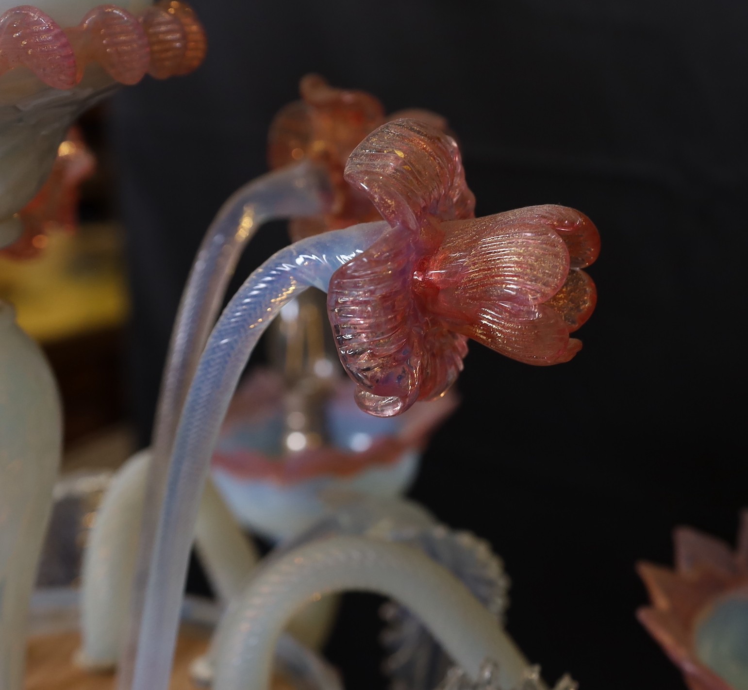 A 1950s Venetian pink and Vaseline glass six light chandelier with ornate flower and leaf motifs, height 90cm. width 70cm